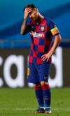 Barcelona's Lionel Messi holds his head during the Champions League quarterfinal match between FC Barcelona and Bayern Munich at the Luz stadium in Lisbon, Portugal, Friday, Aug. 14, 2020. (AP Photo/Manu Fernandez/Pool)