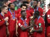 Liverpool's Sadio Mane kisses the trophy after winning the Club World Cup final soccer match between Liverpool and Flamengo at Khalifa International Stadium in Doha, Qatar, Saturday, Dec. 21, 2019. (AP Photo/Hassan Ammar)
