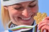 Switzerland's Lara Gut-Behrami eyes her gold medal after a women's giant slalom, at the alpine ski World Championships, in Cortina d'Ampezzo, Italy, Thursday, Feb. 18, 2021. (AP Photo/Marco Tacca)