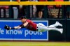 Arizona Diamondbacks right fielder Kole Calhoun makes a diving catch on a line drive hit by Chicago Cubs' Jake Marisnick during the second inning of a baseball game, Sunday, July 18, 2021, in Phoenix. (AP Photo/Ross D. Franklin)