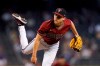 Arizona Diamondbacks starting pitcher Luke Weaver throws against the Cincinnati Reds during the first inning of a baseball game Sunday, April 11, 2021, in Phoenix. (AP Photo/Ross D. Franklin)