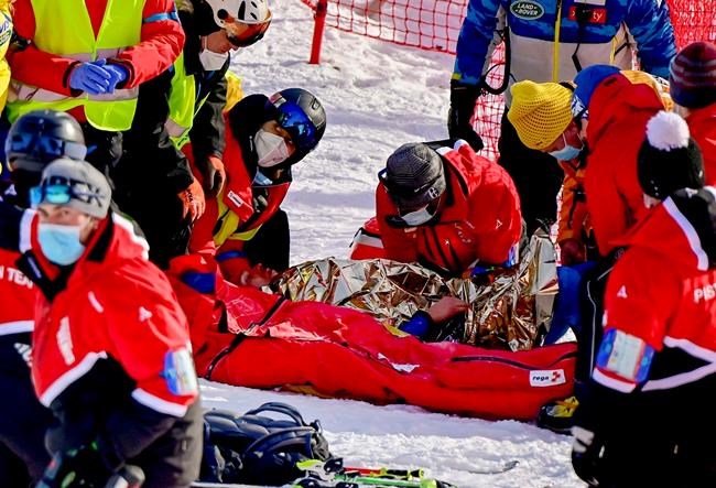 Injured Tommy Ford from the US during the first run of the men's giant slalom race at the FIS Alpine Skiing World Cup in Adelboden, Switzerland, Saturday, January 9, 2021. (Jean-Christophe Bott/Keystone via AP)