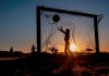 Children play soccer on a meadow with makeshift goals in Obernhain near Frankfurt, Germany, Tuesday, May 5, 2020. Due to the coronavirus playgrounds in German were closed until last Monday. (AP Photo/Michael Probst)