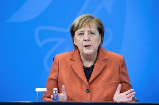 After the switching conference between her and the prime ministers of the federal states, Chancellor Angela Merkel (CDU) comments on the further procedure in the Corona crisis at a press conference in the Federal Chancellery, on Sunday, Dec.13, 2012. (Bernd von Jutrczenka/dpa via AP)