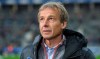 Berlin's head coach Juergen Klinsmann looks up before the start of the German Bundesliga soccer match between Hertha BSC Berlin and Borussia Dortmund in Berlin, Germany, Saturday, Nov. 30, 2019. (Andreas Gora/dpa via AP)