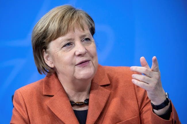 After the switching conference between her and the prime ministers of the federal states, Chancellor Angela Merkel (CDU) comments on the further procedure in the Corona crisis at a press conference in the Federal Chancellery, on Sunday, Dec.13, 2020. (Bernd von Jutrczenka/dpa via AP)
