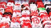 Shirts of the fans hang over the seats prior to the German Bundesliga soccer match between 1. FC Cologne and FSV Mainz 05 in Cologne, Germany, Sunday, May 17, 2020. The German Bundesliga becomes the world's first major soccer league to resume after a two-month suspension because of the coronavirus pandemic. (AP Photo/Lars Baron, Pool)