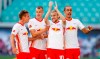 Leipzig's Emil Forsberg celebrates with team mate after scoring with a penalty during a German Bundesliga soccer match between RB Leipzig and FSV Mainz 05 in Leipzig, Germany, Sunday, Sept.20, 2020.( Jan Woitas/dpa via AP)