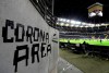 FILE - In this Thursday, March 12, 2020 file photo shows a sign taped by Eintracht fans on a wall of the stadium during a Europa League round of 16, 1st leg soccer match between Eintracht Frankfurt and FC Basel in Frankfurt, Germany. German Bundesliga will restart on May 16. (AP Photo/Michael Probst)