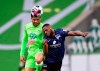Wolfsburg's Paulo Otavio, left, and Berlin's Deyovaisio Zeefuik challenge for the ball during a German Bundesliga soccer match between VfL Wolfsburg and Hertha BSC Berlin in Wolfsburg, Germany, Saturday, Feb.27, 2021. (Swen Pfoertner/dpa via AP)