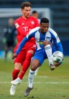 Leon Goretzka, left, of Bayern Munich and Berlin's Javairo Dilrosun vie for the ball during a German Bundesliga soccer match between Hertha BSC Berlin and Bayern Munich in Berlin, Germany, Sunday, Jan.19, 2020. ( Andreas Gora/dpa via AP)