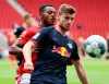 Timo Werner, right, of Leipzig in action against messenger Baku of Mainz during a German Bundesliga soccer match between FSV Mainz 05 and RB Leipzig in Mainz, Germany, Sunday, May 24, 2020. (Kai Pfaffenbach/pool via AP)
