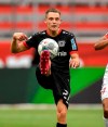 FILE - In this June 27, 2020 file photo,Bayer Leverkusen's Florian Wirtz, left, and Mainz's Karim Onisiwo challenge for the ball during the German Bundesliga soccer match between Bayer 04 Leverkusen and FSV Mainz 05 in Leverkusen, Germany, (AP Photo/Martin Meissner,file)