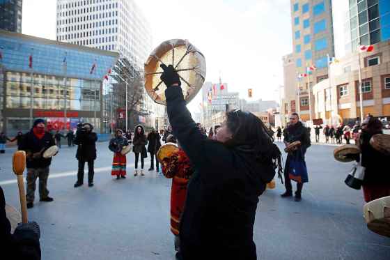 JOHN WOODS / WINNIPEG FREE PRESSProtesters in support of Wet’suwet’en blockades hold a round dance at Portage and Main closing the intersection to vehicle traffic.