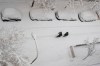 Two men walk slowly in the middle of a street after a heavy snowfall in Madrid, Spain, Saturday, Jan. 9, 2021. Spain is on high alert as a cold snap is covering much of the country with snow disrupting road, sea, rail and air traffic with the capital, Madrid enduring what the city's mayor described as 