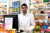 In this photo taken on March 18, 2020, soccer player Toni Dovale poses while working in his family pharmacy in A Coruna, Spain. Dovale, a former Sporting Kansas City and Celta Vigo player who came through Barcelona's famed youth academy, is back at work in his home country while soccer competitions remain on hold because of the COVID-19 virus. Dovale is making calls to try to guarantee there are enough protective masks, gloves and other medical supplies that can help slow the spread of the virus in hard-hit Spain. The COVID-19 coronavirus causes mild or moderate symptoms for most people, but for some, especially older adults and people with existing health problems, it can cause more severe illness or death. (Photo via AP)