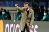 Basaksehir's manager Okan Buruk signals during a Group H Champions League soccer match between RB Leipzig and Istanbul Basaksehir at the RB Arena in Leipzig, Germany, Tuesday Oct. 20, 2020. (AP Photo/Markus Schreiber)