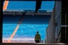 Workers walk into Real Madrid's Santiago Bernabeu stadium in Madrid, Spain, Monday, May 25, 2020. Spanish league clubs are now allowed to train with groups of up to 14 players as the league stays on track to restart in less than three weeks. (AP Photo/Paul White)