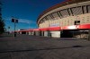 A man jogs past Atletico Madrid's Wanda Metropolitano stadium in Madrid, Spain, Tuesday, May 5, 2020. The Spanish soccer league aims to restart in June without spectators. It's new compulsory protocols say all players, coaches and club employees must be tested for COVID-19 coronavirus before training resumes, then regularly after that. All clubs' training facilities must be properly prepared and disinfected before players can start practicing individually. (AP Photo/Paul White)