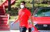 In this photo provided by Atletico Madrid, Diego Costa wearing a face mask and gloves attends the club's training ground in Madrid, Spain, on Wednesday May 6, 2020. Soccer players in Spain returned to their team's training camps Wednesday for the first time since the country entered a lockdown nearly two months ago because of the coronavirus pandemic. (Atletico Madrid via AP)