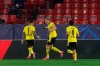 Dortmund's Erling Haaland, centre, celebrates after scoring his side's second goal during the Champions League, round of 16, first leg soccer match between Sevilla and Borussia Dortmund at the Ramon Sanchez Pizjuan stadium in Seville, Spain, Wednesday, Feb. 17, 2021. (AP Photo/Angel Fernandez)