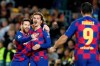 Barcelona's Lionel Messi, left, celebrates after scoring his side's second goal with Antoine Griezmann, centre and Luis Suarez during a Champions League soccer match Group F between Barcelona and Dortmund at the Camp Nou stadium in Barcelona, Spain, Wednesday, Nov. 27, 2019. (AP Photo/Joan Monfort)