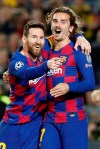 Barcelona's Lionel Messi, left, celebrates after scoring his side's second goal with Antoine Griezmann during a Champions League soccer match Group F between Barcelona and Dortmund at the Camp Nou stadium in Barcelona, Spain, Wednesday, Nov. 27, 2019. (AP Photo/Joan Monfort)