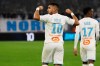 Marseille's Dimitri Payet, left, celebrates after scoring the opening goal during a French League One soccer match between Marseille and Toulouse at the Stade Velodrome in Marseille, southern France, Saturday Feb. 8, 2020. (AP Photo/Daniel Cole)