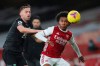 Burnley's Charlie Taylor, left, challenges for the ball with Arsenal's Willian during an English Premier League soccer match between Arsenal and Burnley at the Emirates stadium in London, England, Sunday Dec. 13, 2020. (Catherine Ivill/Pool via AP)