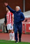 Tottenham's manager Jose Mourinho reacts during the English League Cup quarterfinal soccer match between Stoke City and Tottenham Hotspur at the Bet365 Stadium in Stoke on Trent, England, Wednesday Dec. 23, 2020. (AP Photo/Rui Vieira)