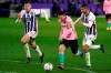 Barcelona's Lionel Messi, centre, runs past Real Valladolid's Ruben Alcaraz, right during a Spanish La Liga soccer match between Valladolid and Barcelona at the Jose Zorrilla stadium in Valladolid, Spain,Tuesday Dec. 22, 2020. (Cesar Manso/Pool via AP)