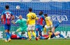 Brighton's Neal Maupay, right gets his shot deflected over the bar during an English Premier League soccer match between Crystal Palace and Brighton at the Selhurst Park stadium in London, England, Sunday Oct. 18, 2020. (Adrian Dennis/Pool via AP)