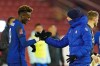 Chelsea's head coach Thomas Tuchel, right shakes hands with match winner Chelsea's Tammy Abraham at the end of the English FA Cup fifth round soccer match between Barnsley and Chelsea at the Oakwell Stadium in Barnsley, England,Thursday Feb. 11, 2021. (AP Photo/Dave Thompson, Pool)