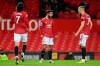 Manchester United's Bruno Fernandes, centre, celebrates after scoring his side's second goal during an English Premier League soccer match between Manchester United and Everton at the Old Trafford stadium in Manchester, England, Saturday Feb. 6, 2021. (Michael Regan/Pool via AP)