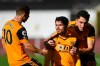 Wolverhampton Wanderers' Pedro Neto, centre celebrates with team mates after scoring his side's opening goal during an English Premier League soccer match between Wolverhampton Wanderers and Fulham at the Molineux Stadium in Wolverhampton, England, Sunday Oct. 4, 2020. (Stu Forster/Pool via AP)