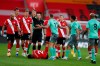 Everton's Lucas Digne, centre, is shown a red card by the referee after a foul on Southampton's Kyle Walker-Peters during an English Premier League soccer match between Southampton and Everton at the St. Mary's stadium in Southampton, England, Sunday Oct. 25, 2020. (AP Photo/Frank Augstein, Pool)