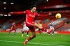Liverpool's Trent Alexander-Arnold kicks the ball during an English Premier League soccer match between Liverpool and West Bromwich Albion at the Anfield stadium in Liverpool, England, Sunday Dec. 27, 2020. (Clive Brunskill/Pool via AP)