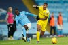Manchester City's Benjamin Mendy, left, challenges for the ball with Fulham's Mario Lemina during an English Premier League soccer match between Manchester City and Fulham at the Etihad stadium in Manchester, England, Saturday, Dec. 5, 2020. (AP Photo/Dave Thompson)