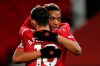 Manchester United's Bruno Fernandes, front, celebrates his side's sixth goal from a penalty kick with Anthony Martial during an English Premier League soccer match between Manchester United and Leeds United at the Old Trafford stadium in Manchester, England, Sunday Dec. 20, 2020. (Clive Brunskill/Pool via AP)