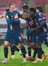 Arsenal's Alexandre Lacazette, centre, celebrates with team mates after scoring his side's third goal during an English Premier League soccer match between Southampton and Arsenal at the St Mary's stadium in Southampton, England, Tuesday Jan. 26, 2021. (Andy Rain/Pool via AP)