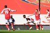 Arsenal's Eddie Nketiah, centre, celebrates after scoring his side's first goal during an English Premier League soccer match between Arsenal and Fulham at the Emirates stadium in London, England, Sunday April 18, 2021. (Facundo Arrizabalaga/Pool via AP