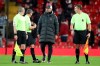 Liverpool's manager Jurgen Klopp speaks with the referee and linesmen at the end of an English Premier League soccer match between Liverpool and West Bromwich Albion at the Anfield stadium in Liverpool, England, Sunday Dec. 27, 2020. (Nick Potts/Pool via AP)