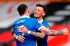 Brighton's Lewis Dunk, left and Ben White celebrate at the end of an English Premier League soccer match between Southampton and Brighton after defeating Southampton at the St Mary's Stadium in Southampton, England, Sunday March 14, 2021. (Andrew Couldridge/Pool via AP)