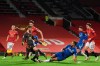 Everton's Dominic Calvert-Lewin, centre right, scores his side's third goal during an English Premier League soccer match between Manchester United and Everton at the Old Trafford stadium in Manchester, England, Saturday Feb. 6, 2021. (Michael Regan/Pool via AP)