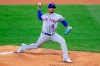 New York Mets starting pitcher Marcus Stroman (0) throws during the first inning of a baseball game against the Philadelphia Phillies, Tuesday, April 6, 2021, in Philadelphia. (AP Photo/Laurence Kesterson)
