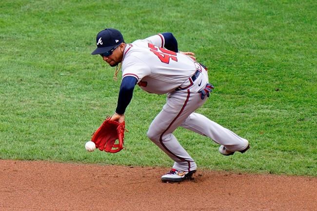 Atlanta Braves second baseman Johan Camargo catches a fielder's choice by Philadelphia Phillies' Adam Haseley during the second inning of a baseball game, Saturday, Aug. 29, 2020, in Philadelphia. Andrew Knapp was forced out at second on the play and Haseley was safe at first. (AP Photo/Matt Slocum)