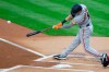 San Francisco Giants' Mike Yastrzemski hits a double during the first inning of a baseball game against the Philadelphia Phillies, Monday, April 19, 2021, in Philadelphia. (AP Photo/Laurence Kesterson)