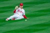 Philadelphia Phillies center fielder Adam Haseley (40) misses a ball hit for a single during the fourth inning of a baseball game, Monday, April 5, 2021, in Philadelphia. (AP Photo/Laurence Kesterson)