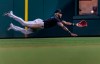 Miami Marlins center fielder Monte Harrison (3) catches a fly ball from Philadelphia Phillies' Luke Williams during the ninth inning of a baseball game Saturday, July 17, 2021, in Philadelphia. (AP Photo/Laurence Kesterson)