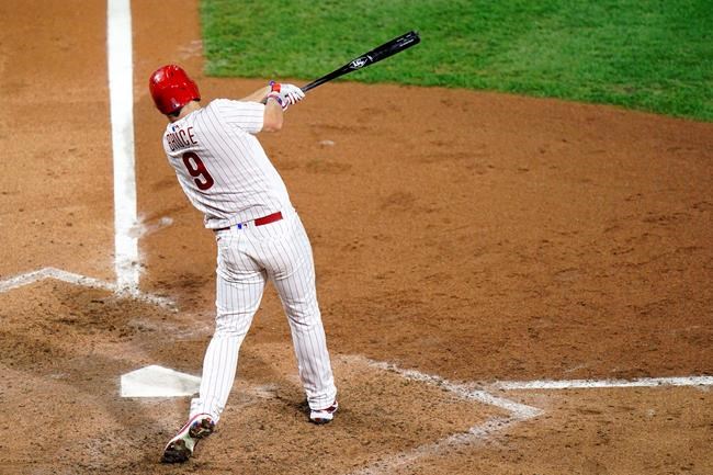 Philadelphia Phillies' Jay Bruce follows through after hitting a home run off Washington Nationals pitcher Max Scherzer during the sixth inning of a baseball game, Wednesday, Sept. 2, 2020, in Philadelphia. (AP Photo/Matt Slocum)